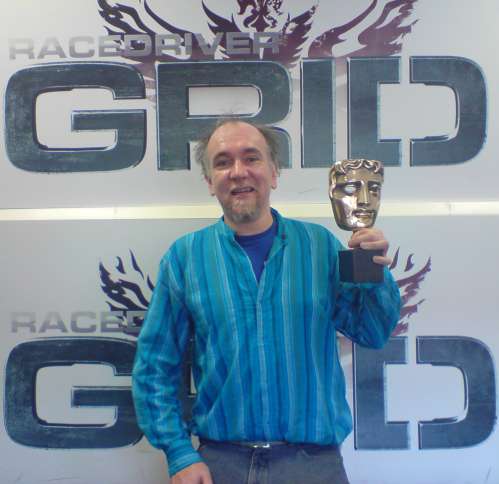 Simon with the BAFTA awarded to the RaceDriver GRID team for the best sports game of 2008